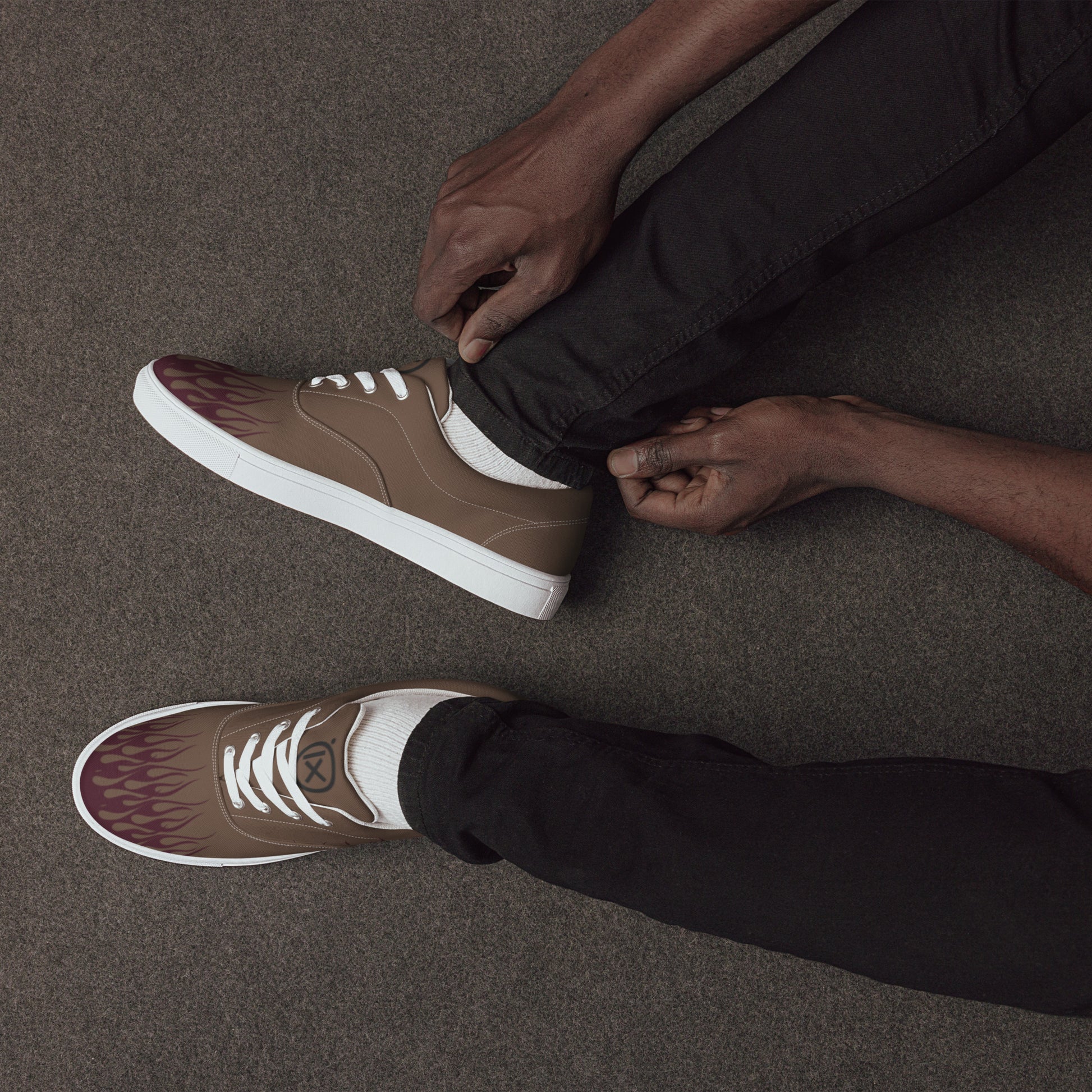 Brown canvas sneakers with burgundy flame graphic, white laces, white sidewall sole