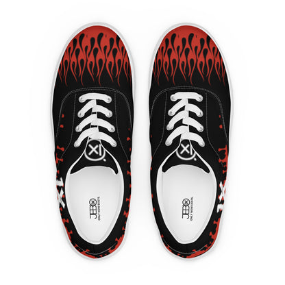 Black canvas sneakers with red flame pattern on toe area, white laces, top view pair.