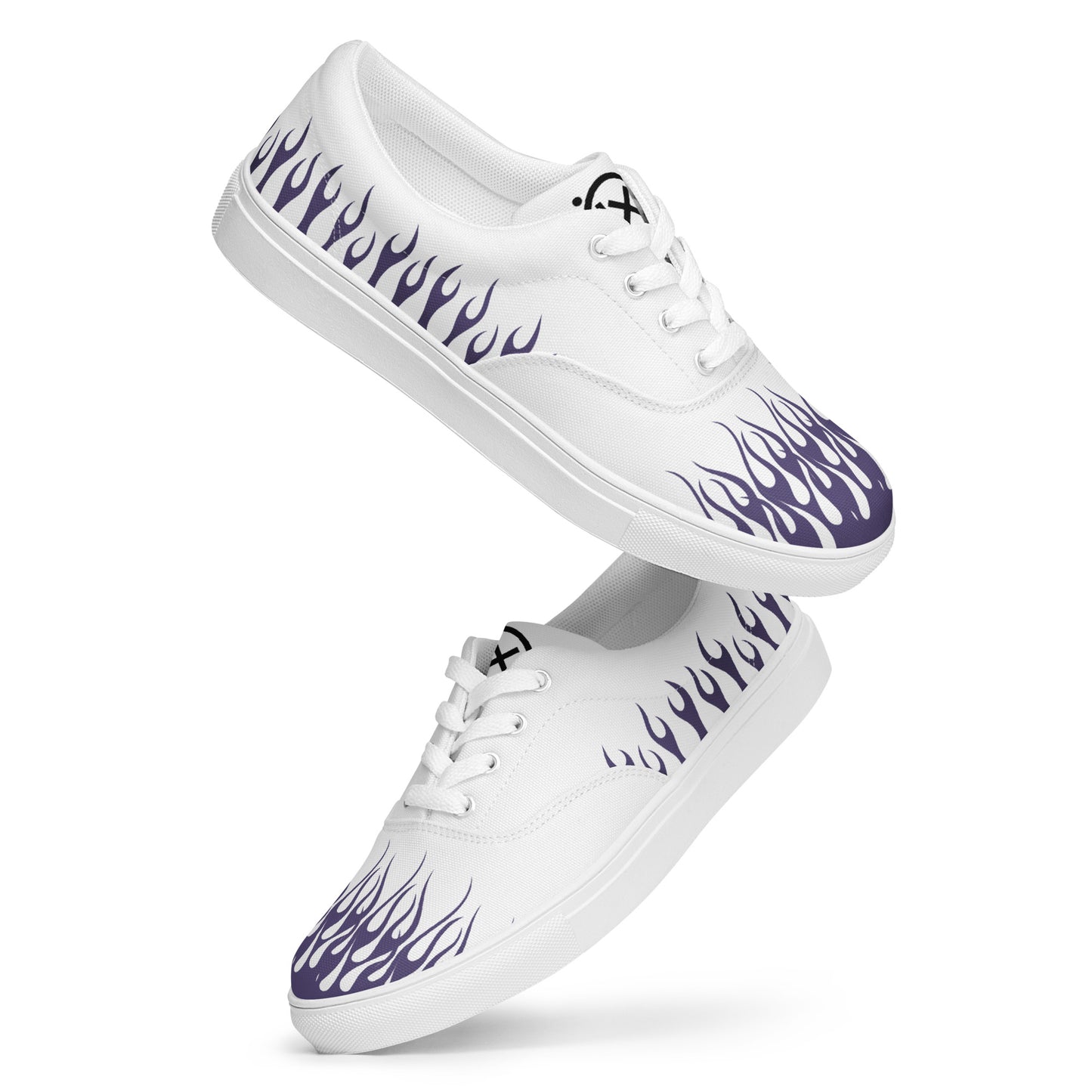 White canvas low-top sneakers with purple flame print and white laces.