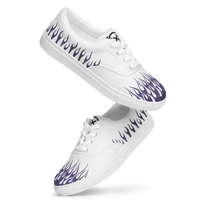 White canvas low-top sneakers with purple flame print and white laces.