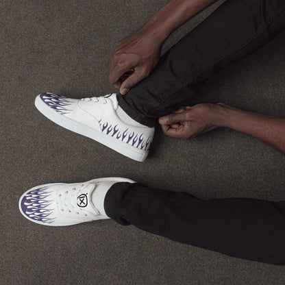 White canvas low-top sneakers with violet flame side print, black rubber sole, lace-up.