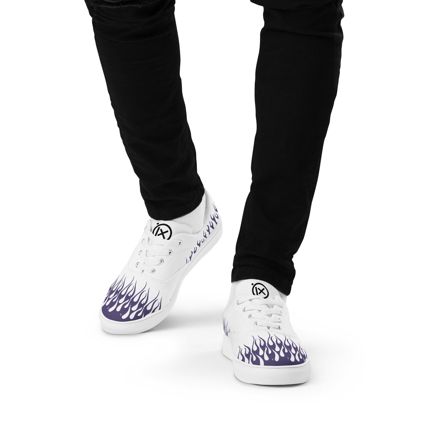 White canvas low-top sneakers with purple flame graphic, lace-up.