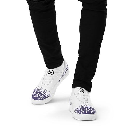 White canvas low-top sneakers with purple flame graphic, lace-up.