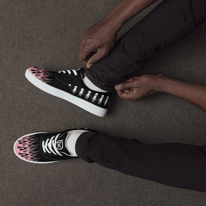 Black canvas sneaker with pink flame side print and white sole, worn