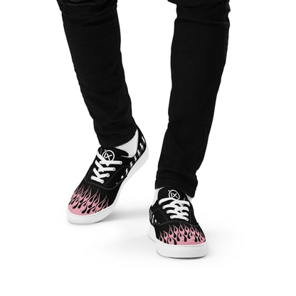 Black canvas sneaker with pink flame print, white laces, and white rubber sole