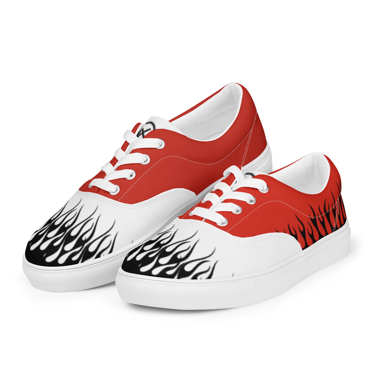Red canvas low-top sneakers with white laces and flame graphics on the front panel