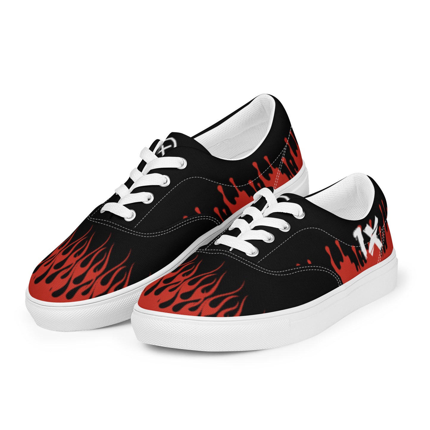Black low-top canvas sneakers with red flame graphic, white soles, lace-up.