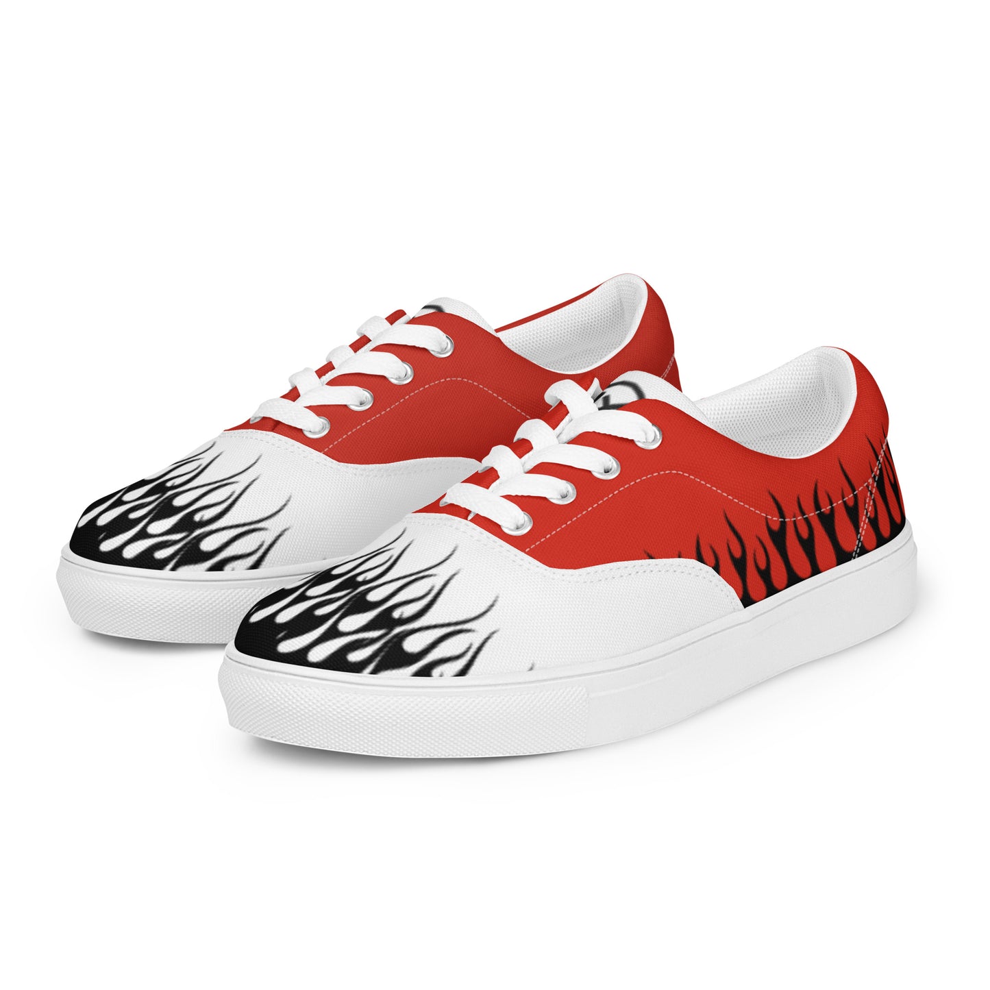 Red and white canvas sneakers with flame-style designs, white laces, and smooth rubber sole