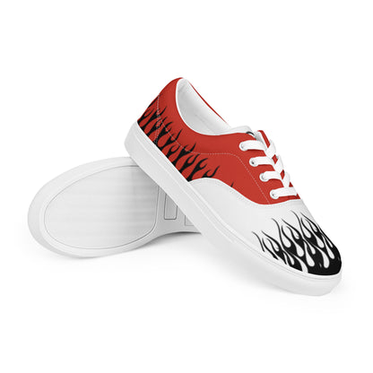 Red and white low-top canvas sneaker with flame-style side graphics and white laces