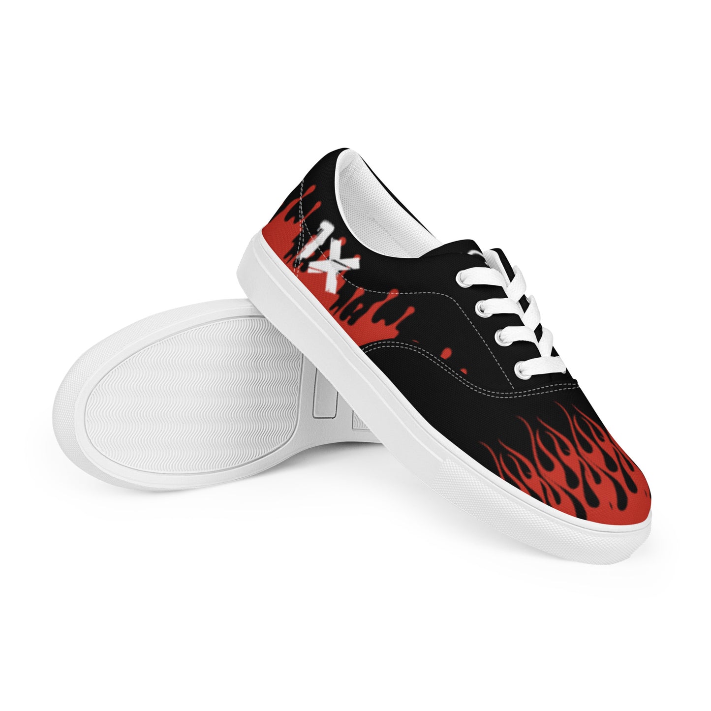 Black canvas sneaker with red flame print side panel, white sole, lace-up.