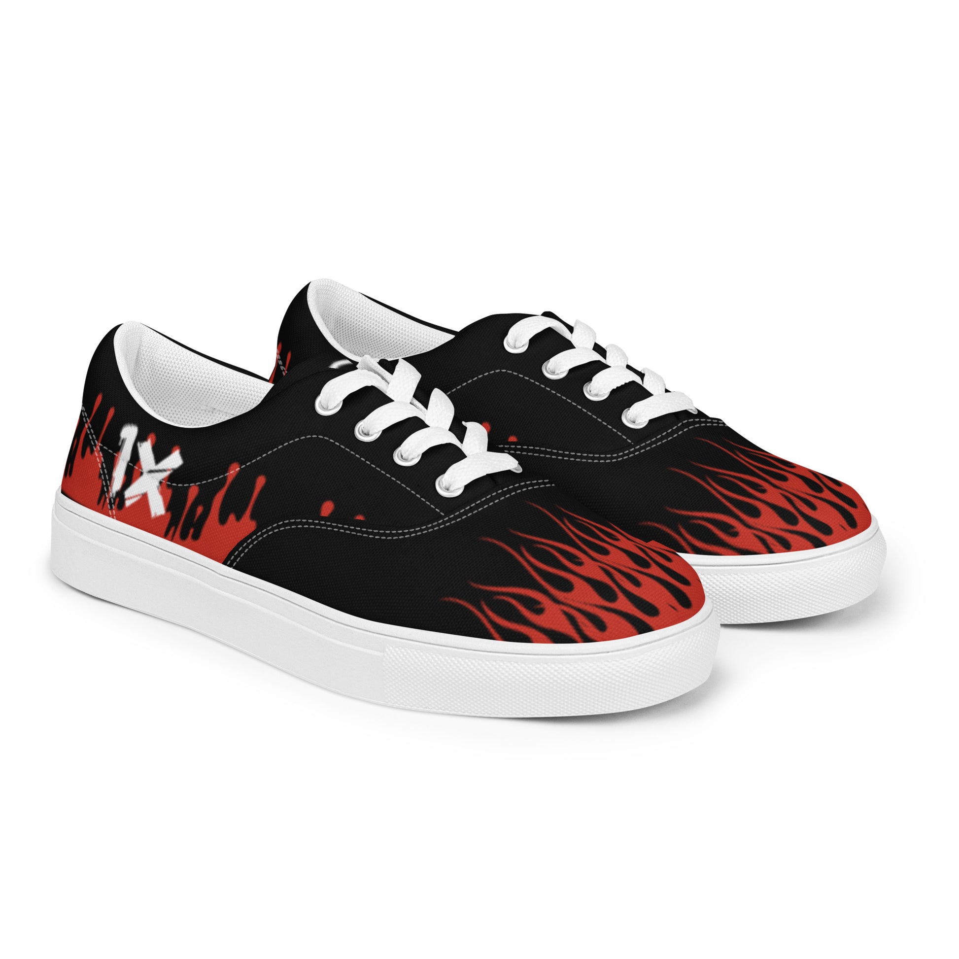 Canvas sneakers angled front view, black with red flame print, white laces and sole