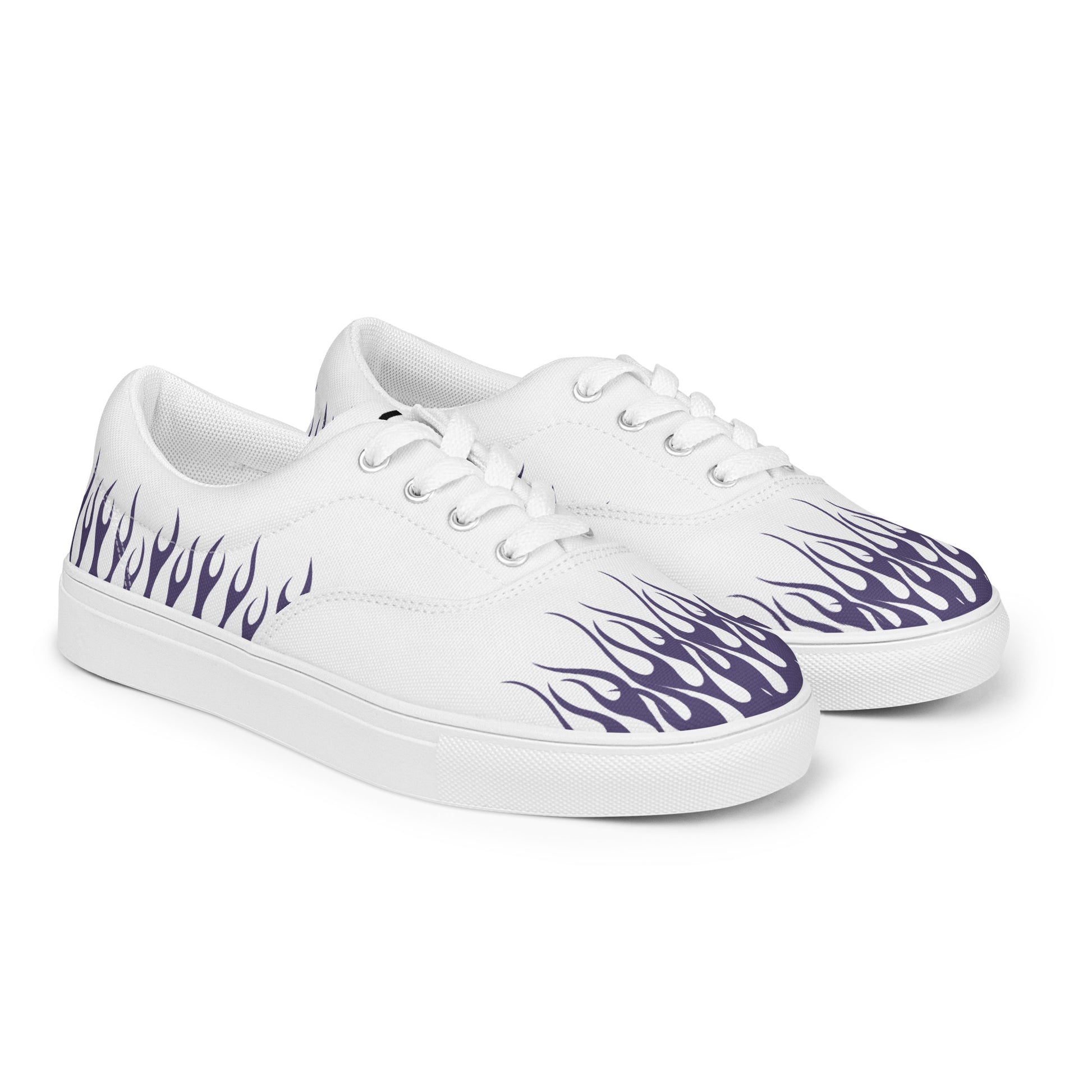 White canvas low-top sneakers with purple flame graphics along the sides.