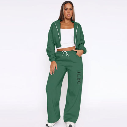 Women’s fleece tracksuit in green: zip-up hoodie with hood and drawstring wide-leg pants.
