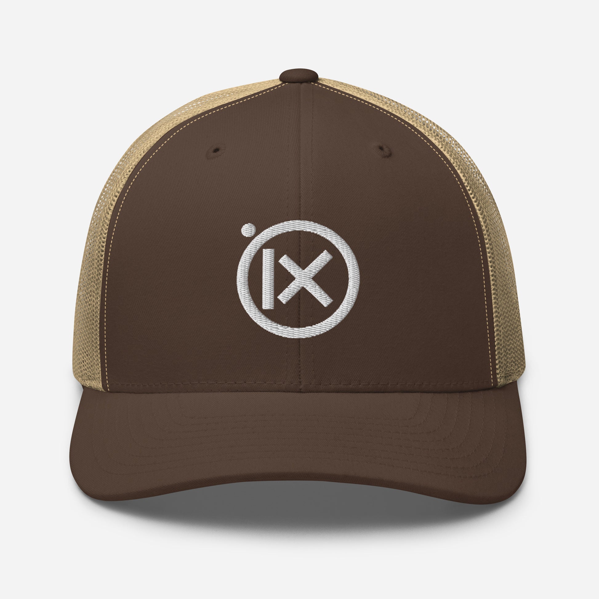 Trucker snapback cap in dark brown with tan mesh and white logo badge