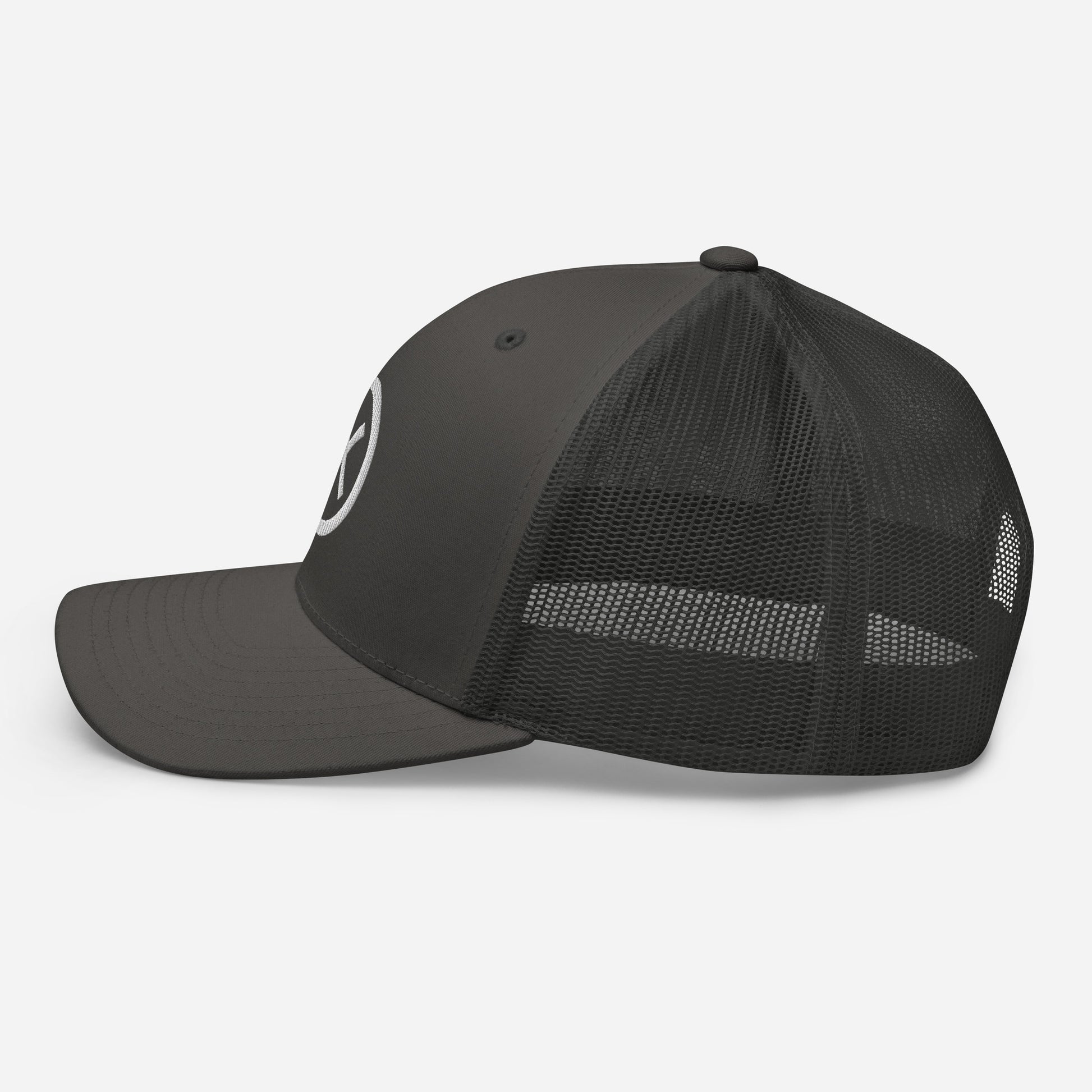 Trucker snapback cap with dark fabric crown, black mesh sides, and curved brim