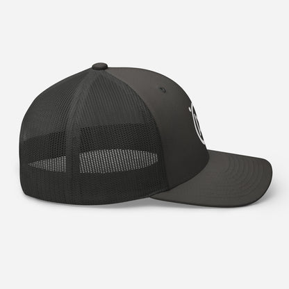 Trucker snapback cap side view, black mesh back panel and dark front with brim