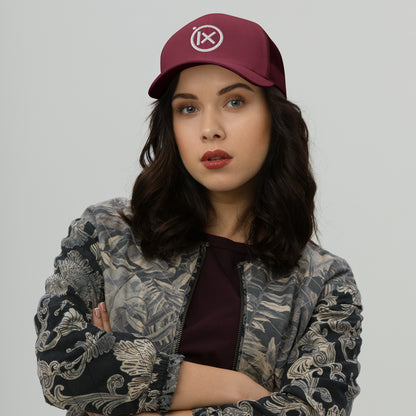 Retro trucker snapback cap in cranberry red with mesh back and circular logo emblem