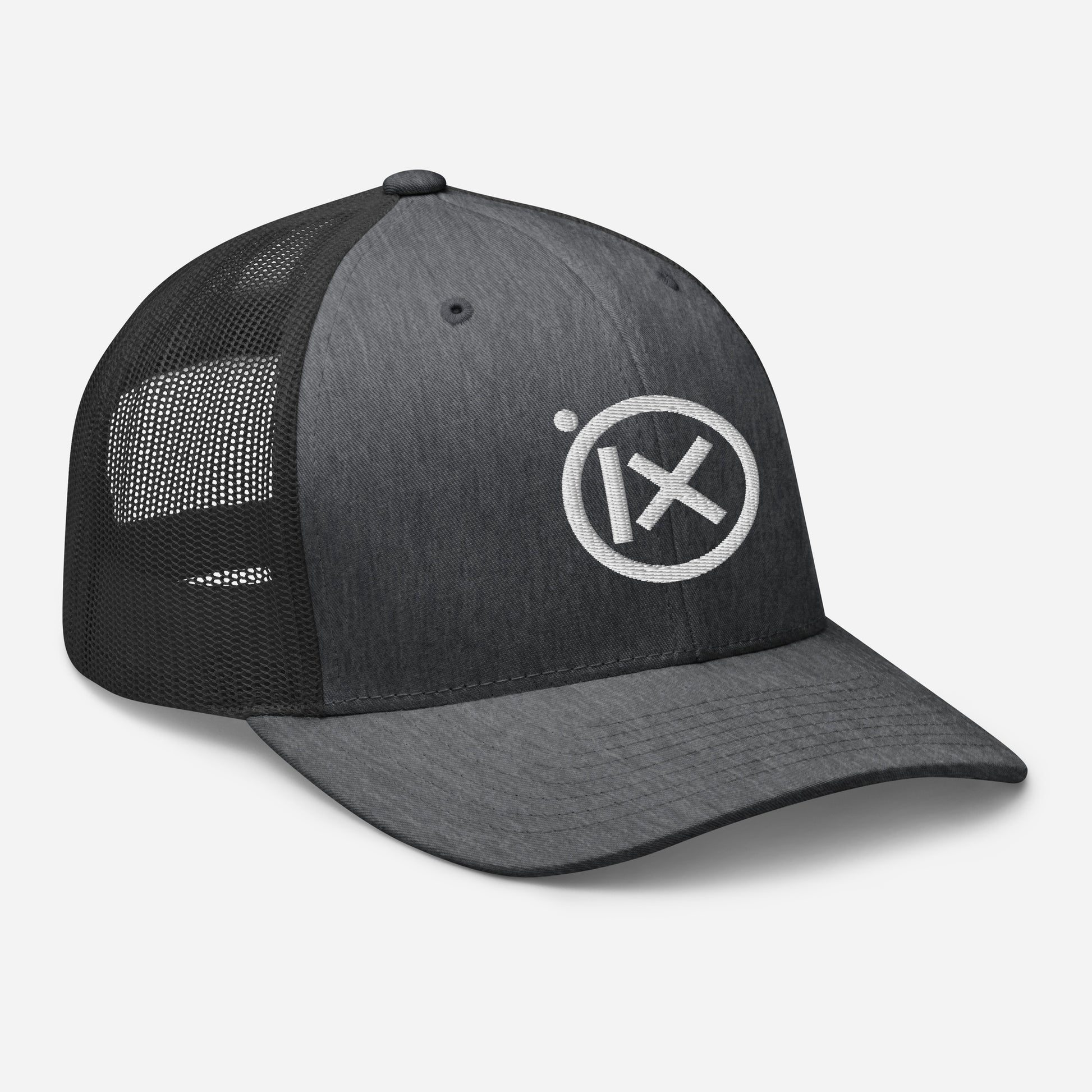 Trucker snapback cap front view, dark crown, black mesh side panels, white logo