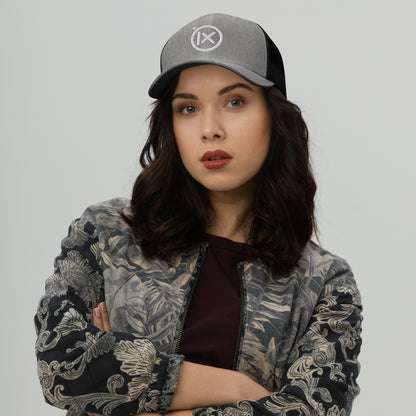 Heather gray trucker snapback hat with white logo patch and black mesh back