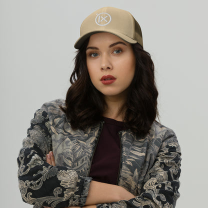 Retro trucker snapback cap in beige with mesh back and circular logo emblem