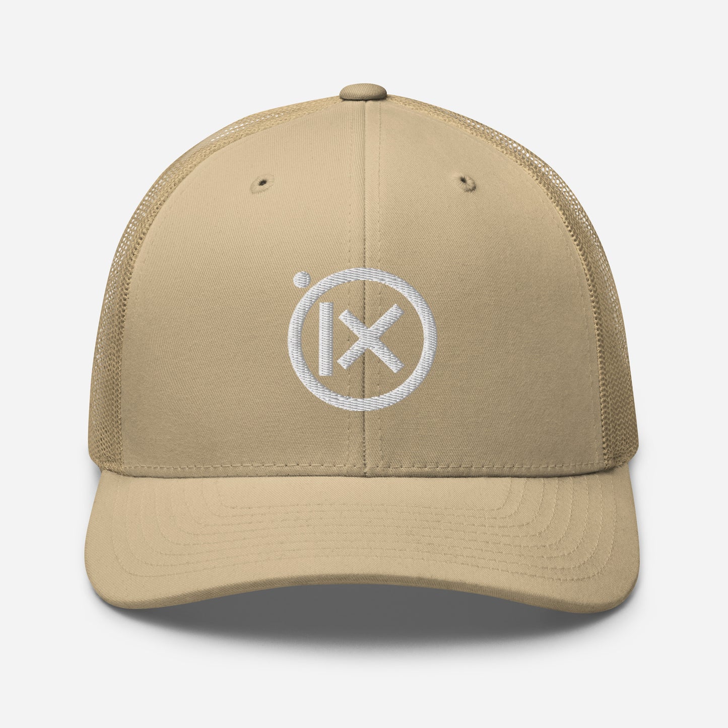 Tan trucker snapback cap with mesh back and white circular X logo on front
