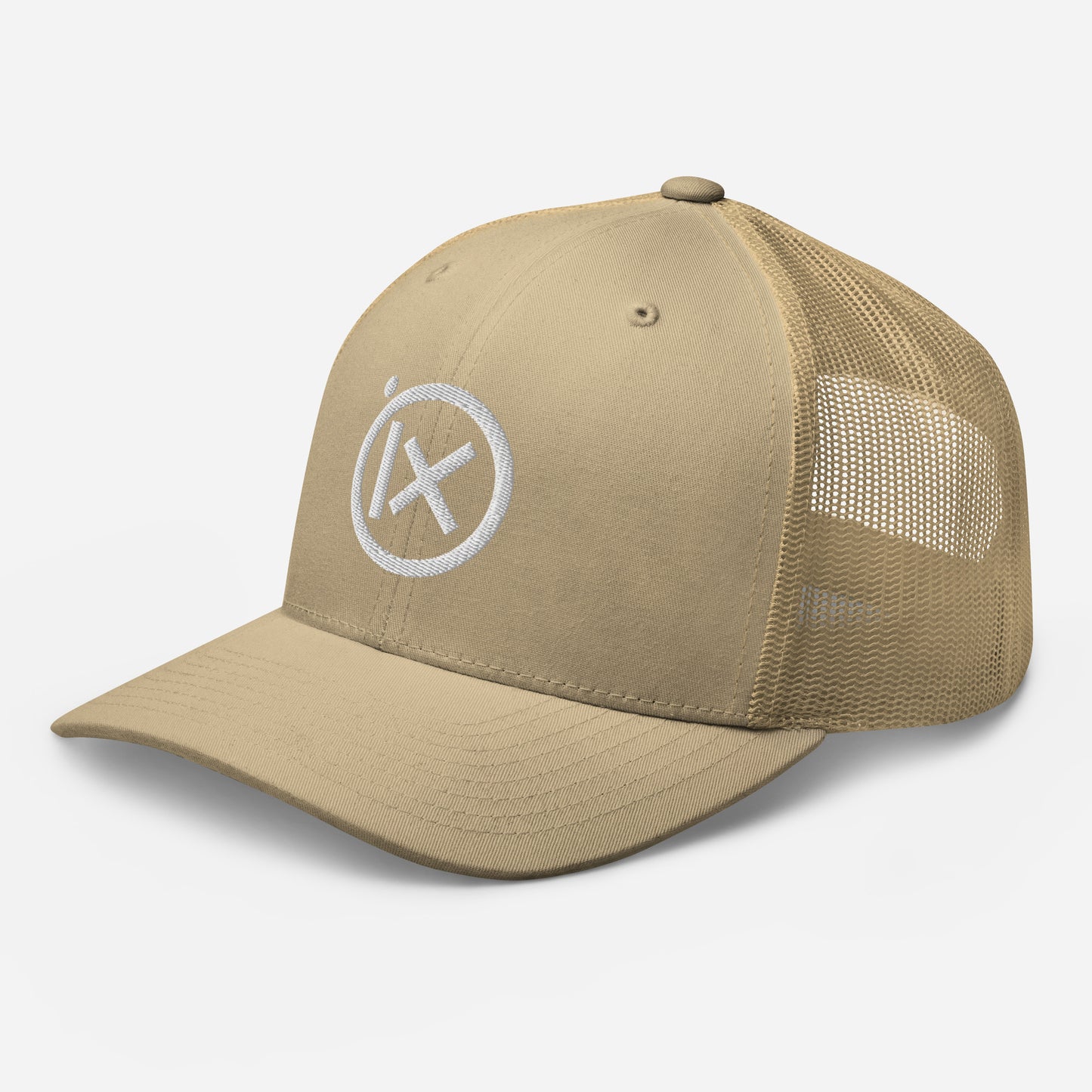 Tan trucker snapback cap with mesh side panels and white circular X logo