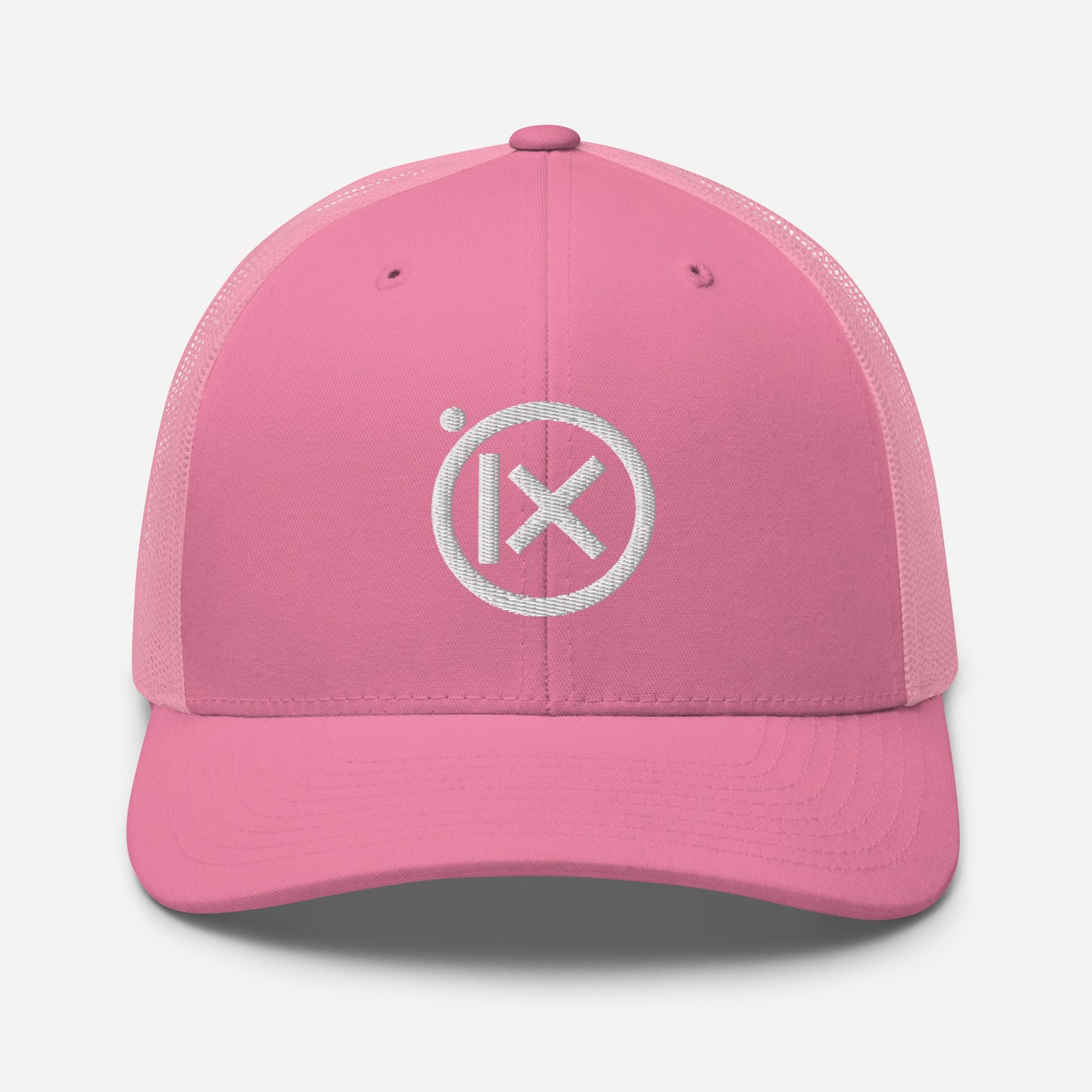 Pink trucker snapback cap with mesh back and white circular X logo on front