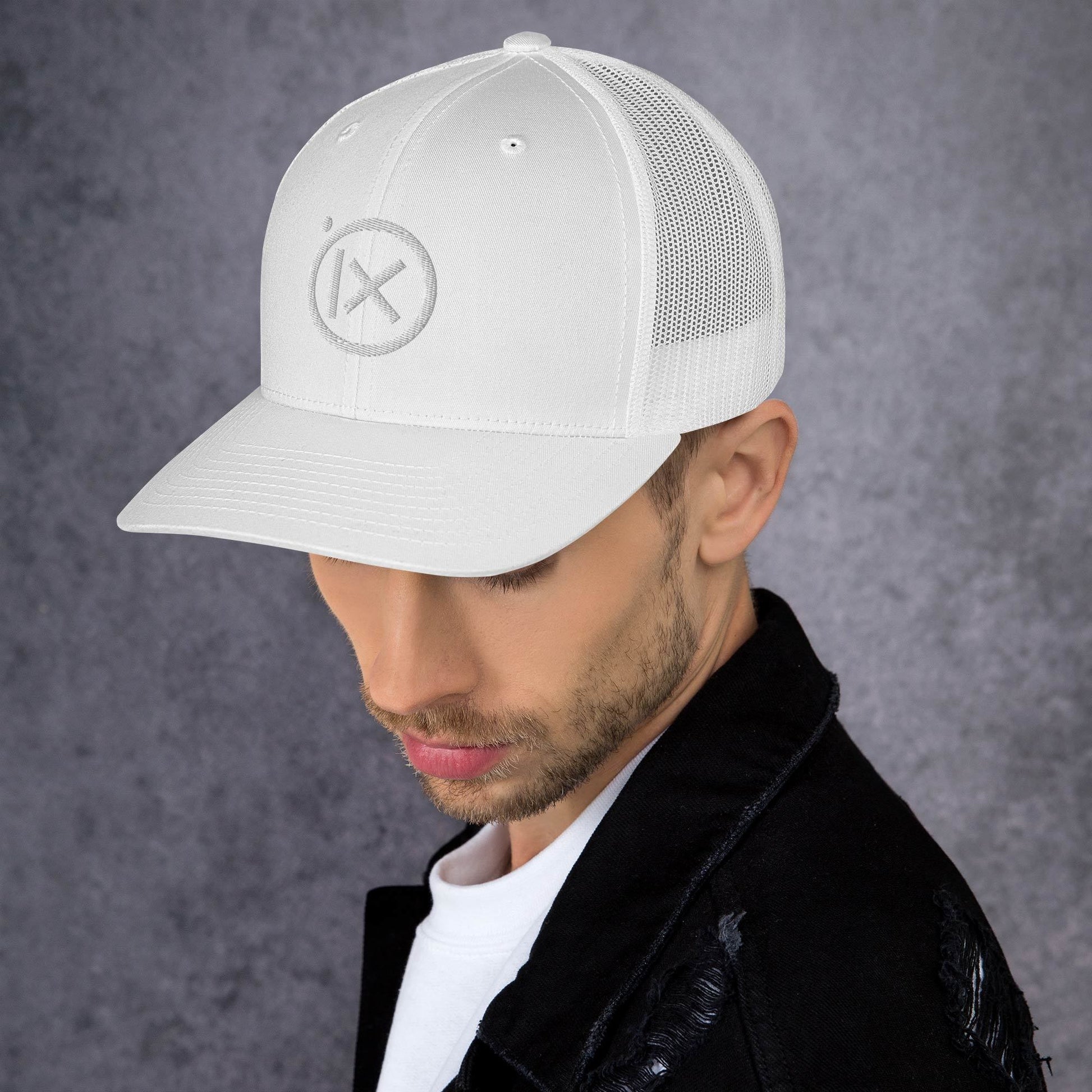 Retro trucker snapback cap in white with mesh back and circular logo emblem