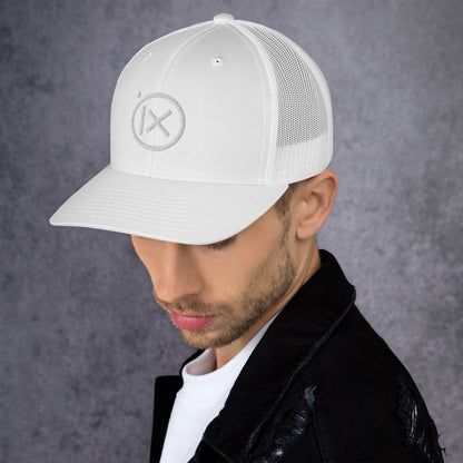 Retro trucker snapback cap in white with mesh back and circular logo emblem