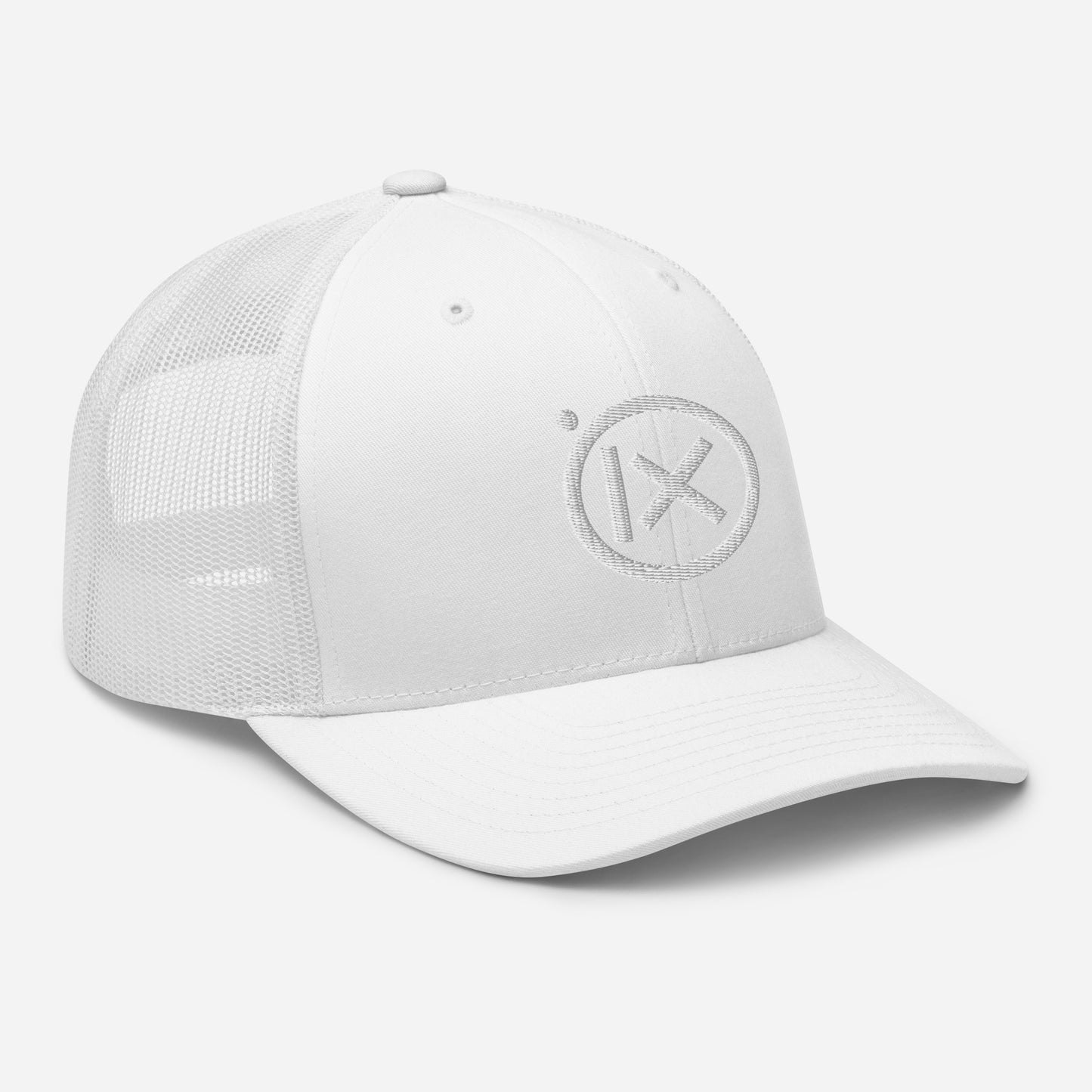 White mesh trucker snapback cap with circular X logo patch and curved brim