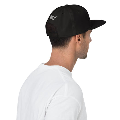 Black snapback cap with side embroidered script and curved brim