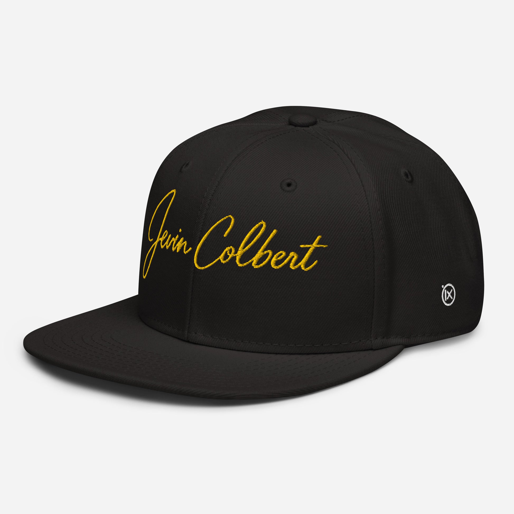 Black snapback cap with yellow “Jevin Colbert” script logo on the front, side view