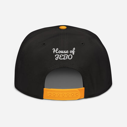 Black snapback cap with orange adjustable strapback and small back logo in white