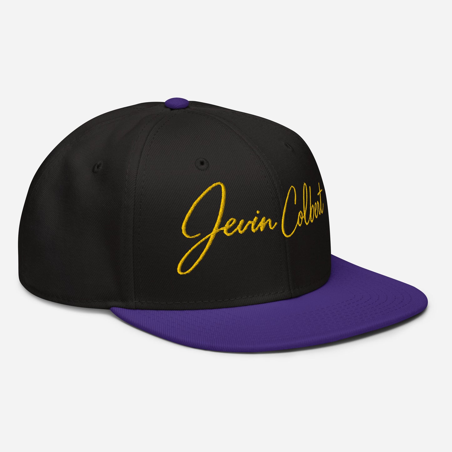 Jevin Colbert snapback cap, black crown with purple brim and yellow front script