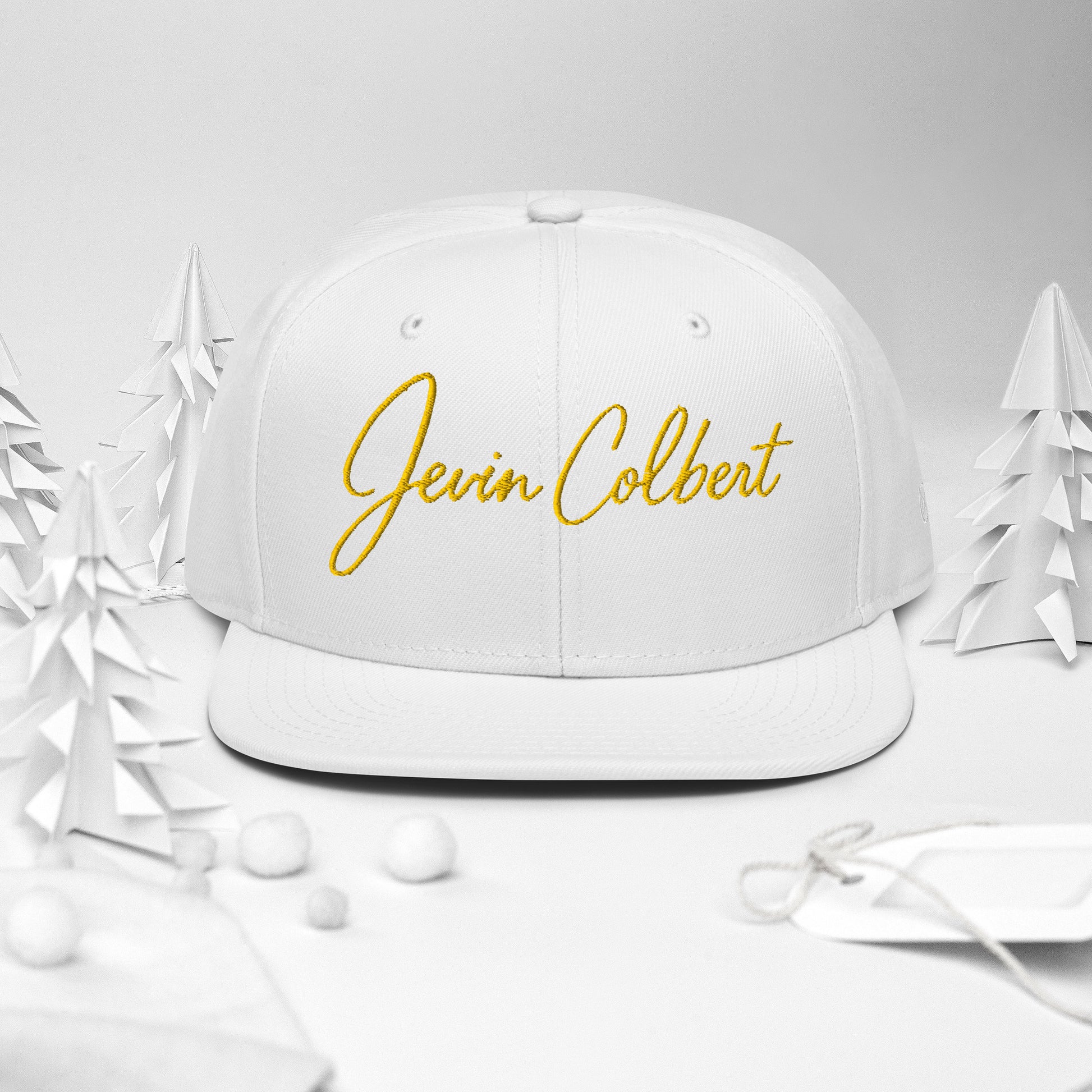 Jevin Colbert snapback cap, white crown with yellow script logo on front