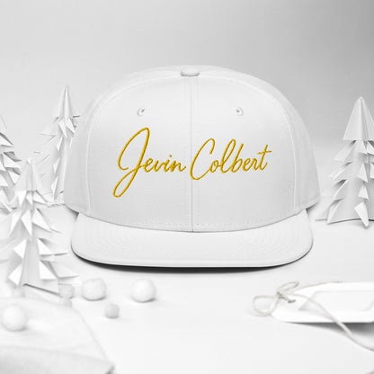 Jevin Colbert snapback cap, white crown with yellow script logo on front
