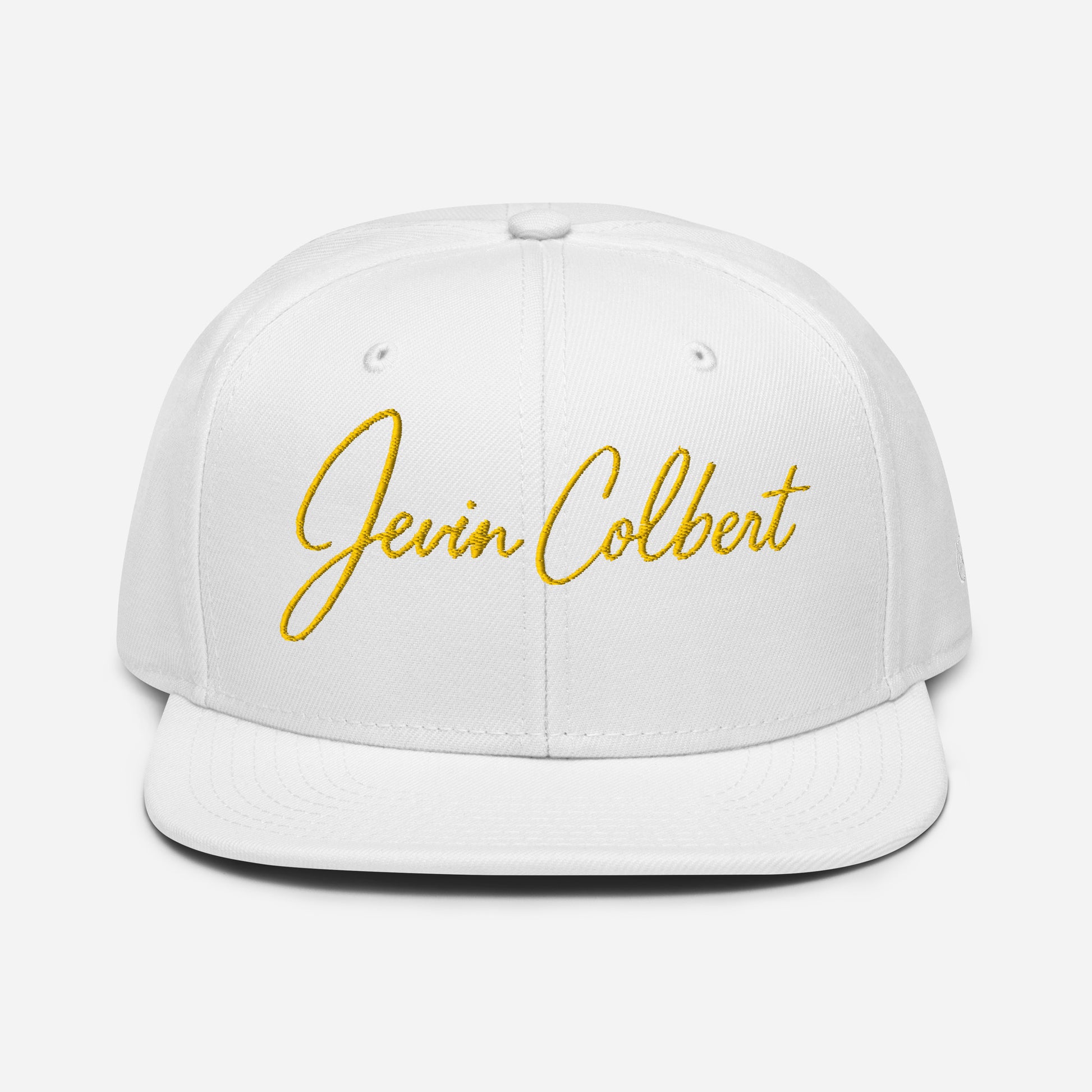 White snapback cap with yellow “Jevin Colbert” script embroidery on the front panel