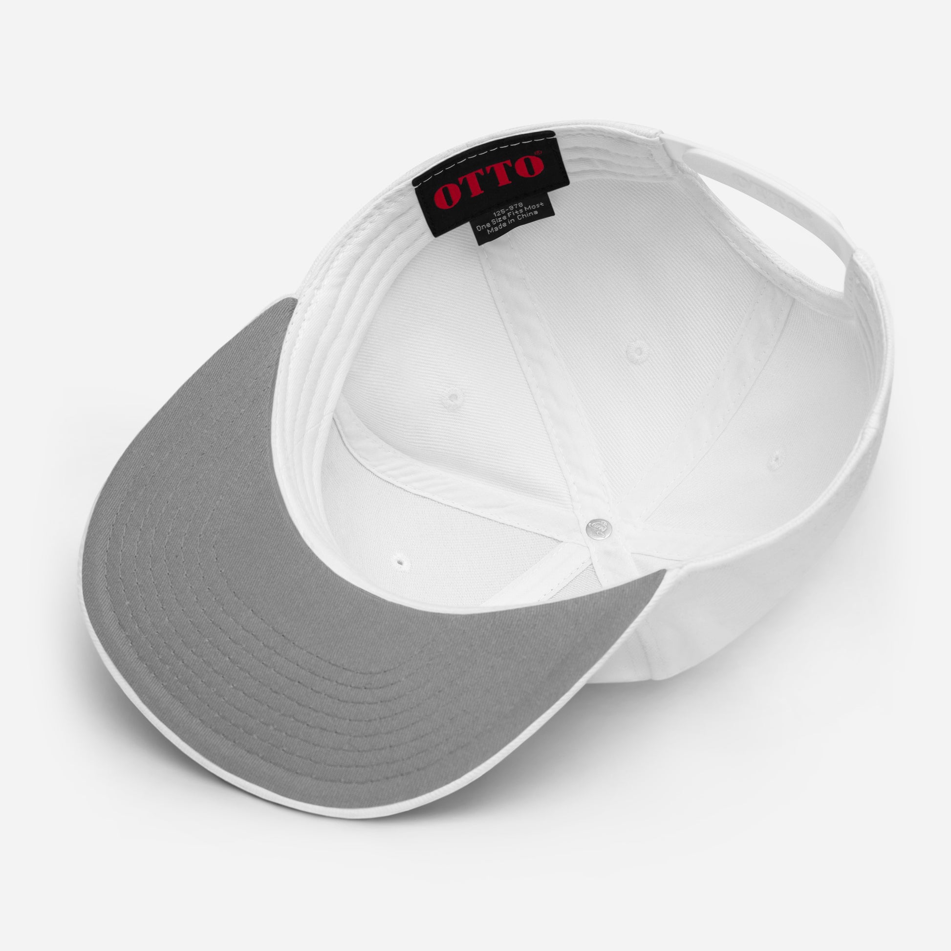 Two-tone white and gray snapback cap with interior OTTO label
