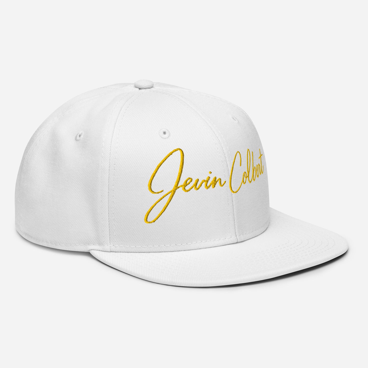 White snapback cap with yellow embroidered Jevin Colbert logo on front panel