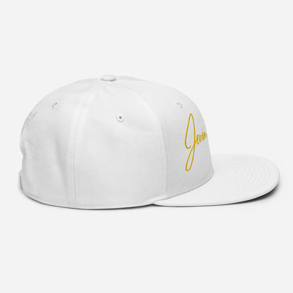 White snapback cap with yellow Jevin Colbert script logo on side and back panels