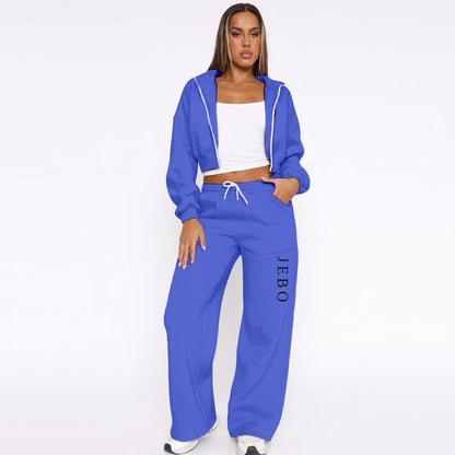 Women’s fleece tracksuit set in blue: zip hoodie jacket and drawstring wide-leg pants.