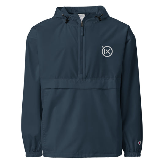 Navy anorak windbreaker with hood, quarter-zip, and ix logo patch at chest.