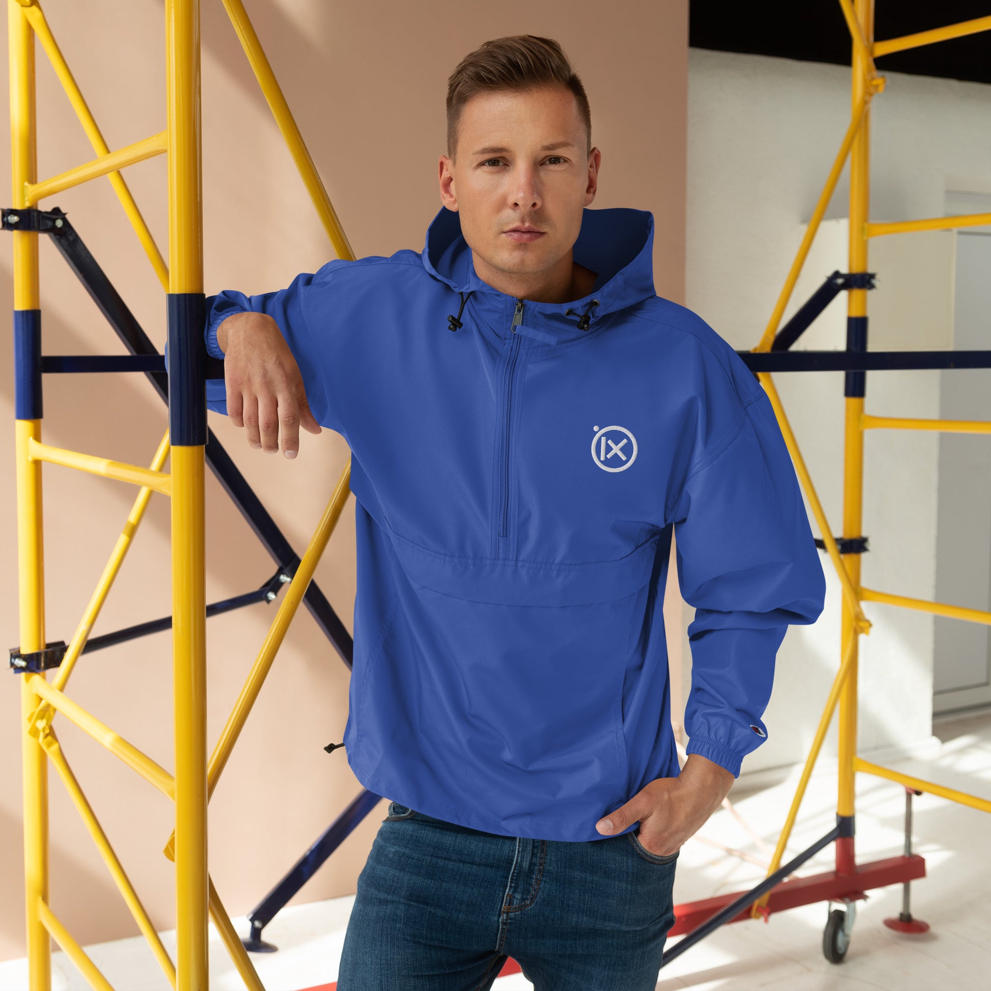 Royal blue anorak windbreaker worn with hood and front zipper