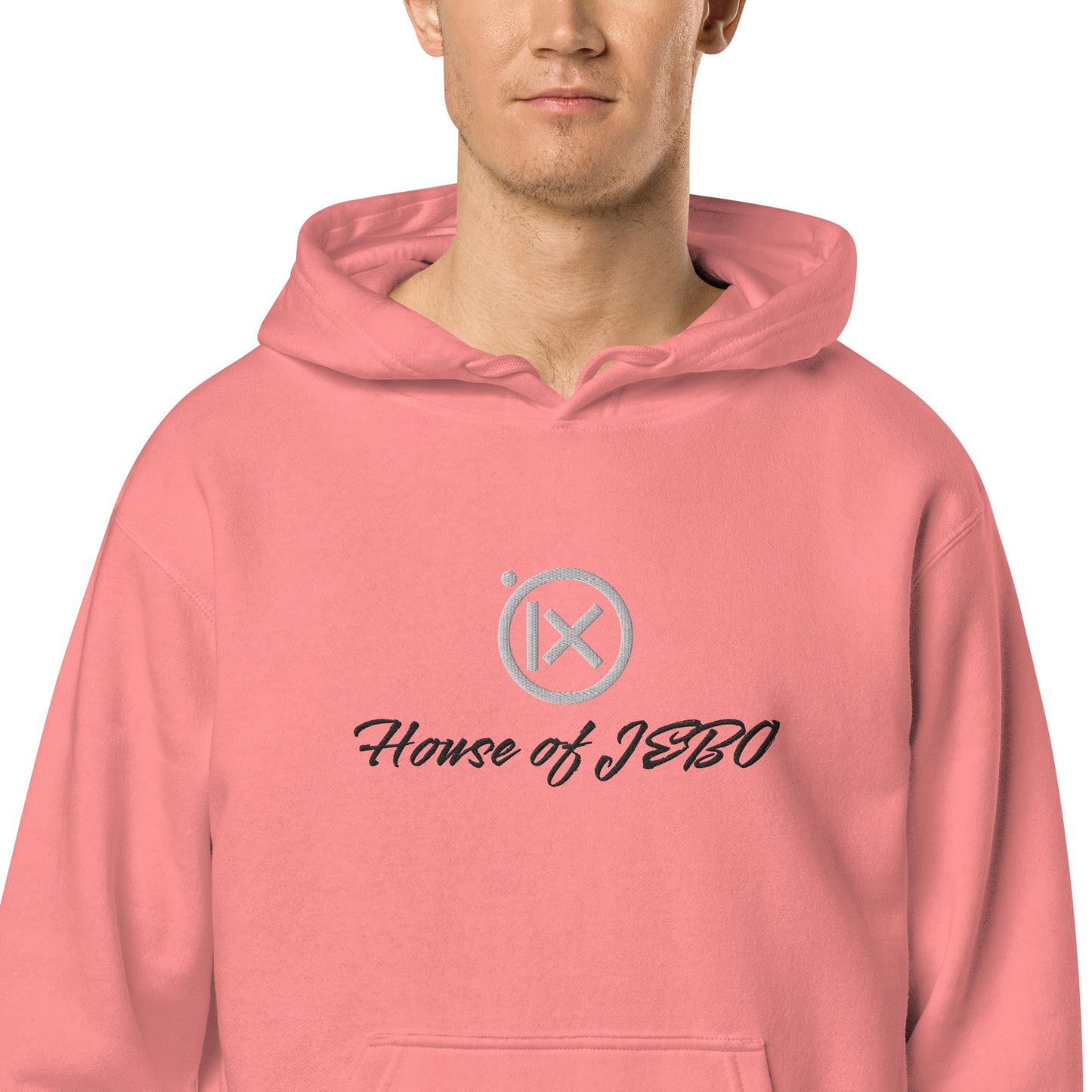 Coral-pink hoodie with hood, front pocket, and House of JERO graphic