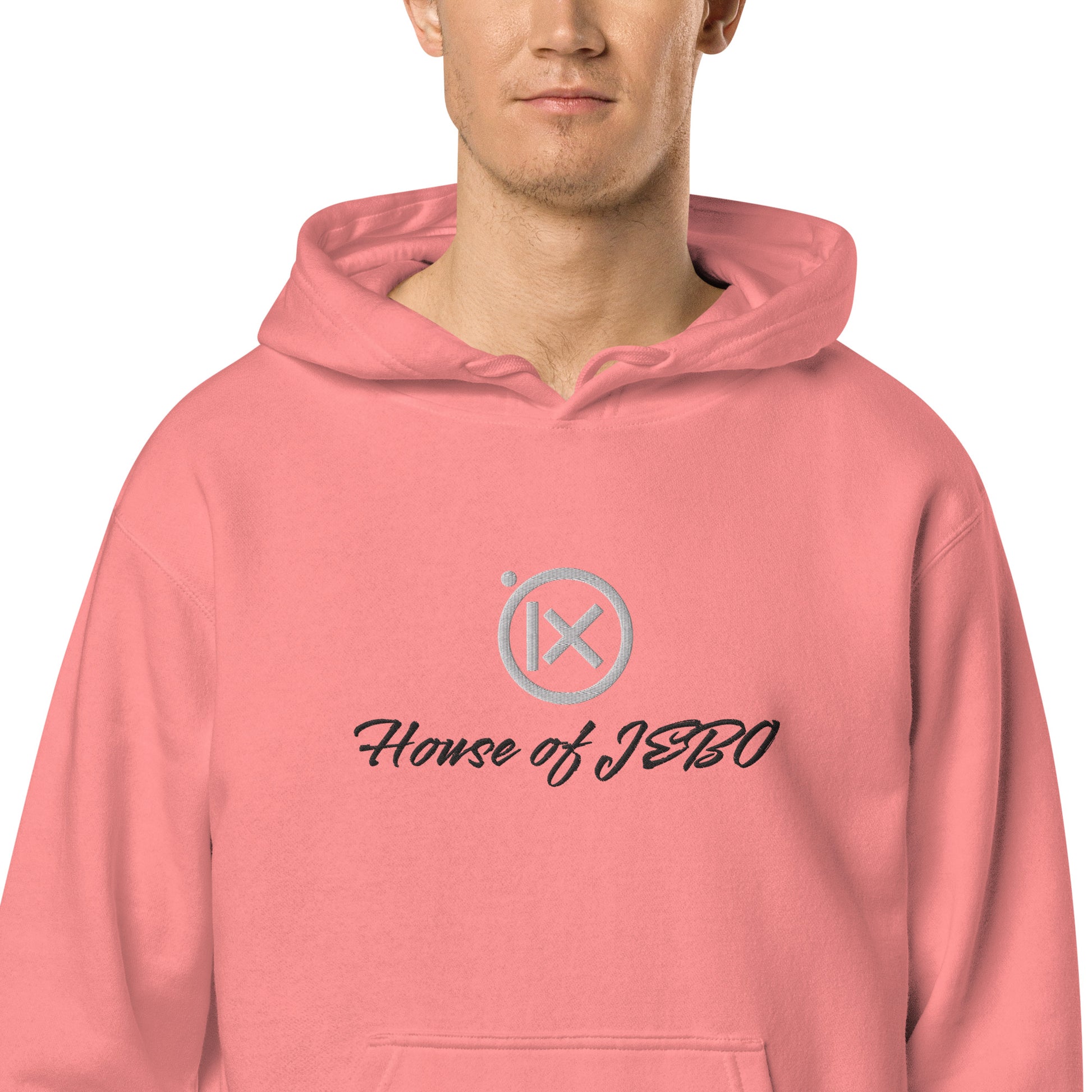 Coral-pink hoodie with hood, front pocket, and House of JERO graphic