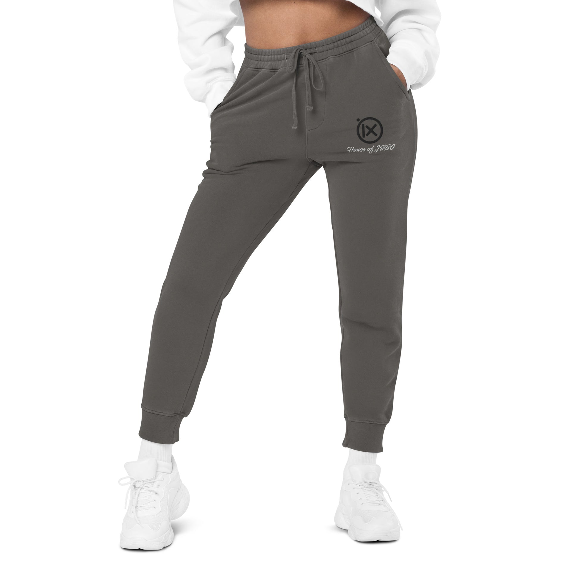 Dark gray jogger sweatpants, elastic waistband with drawstring and side logo