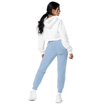 Light blue jogger sweatpants shown from side, drawstring waist and tapered ankle cuffs